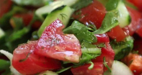 Adding salt to a fresh, vegetable salad, close-up Stock Footage 133823585