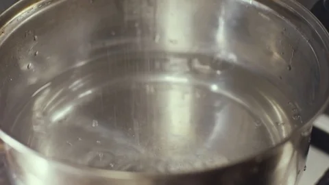 Adding salt in pan Stock Footage 126612207