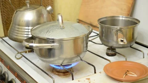 Adding salt into saucepan with boiling water and rice Stock-Footage 47061684
