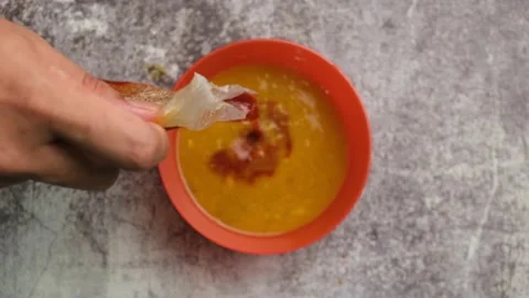 Adding sambal in Dhal Stock Footage 143133831