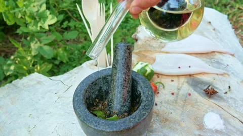 Adding sauce to a granite mortar Stock Footage 146800821