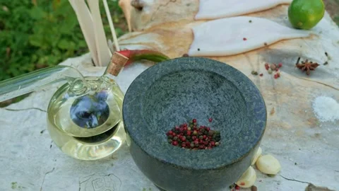 Adding sauce to a granite mortar Stock Footage 146922835