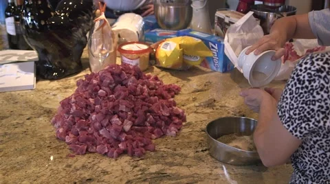 Adding seasoning to meat 스톡 동영상 45618447