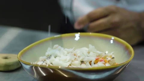 Adding Seasoning to Seafood Dish Video stock 195758191