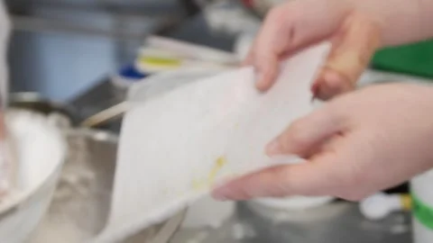 Adding shaved lemon into the powdered sugar Stock-Footage 307339938