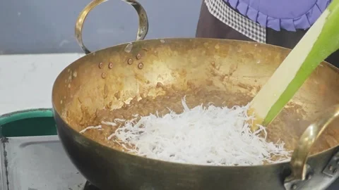 Adding shredded coconut into traditional Thai dessert "Khanom Pad" . 스톡 동영상 339202183