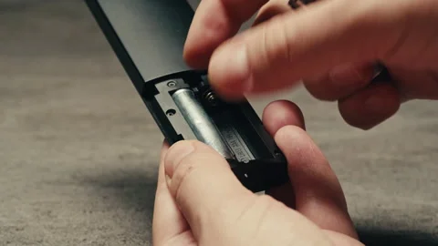 Adding silver batteries AA and AAA in remote controller TV close-up. Batteries Stock-Footage 279184773