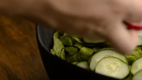 Adding Sliced Watermelon Radish To California Salad Stock Footage 116787271