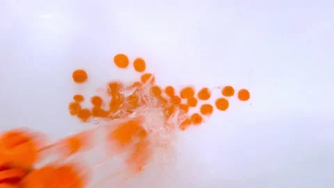 Adding slicing carrots into water Stock Footage 122107345