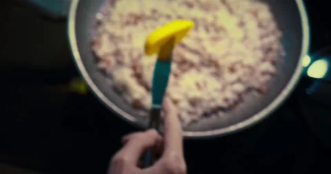 Adding a small piece of butter to the rice Stockbeeldmateriaal 167431680