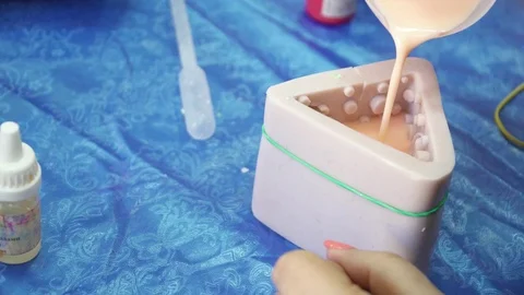 Adding soap base to the template for the handmade soap creation Stock Footage 74360902