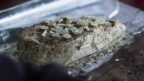 Adding some garlic to a tasty Paneer Stock Footage 132997689