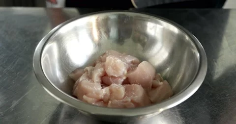 Adding some salt into a raw chicken fillet top view. Stock Footage 159161566