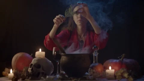 Adding some stuff in cauldron Stock Footage 141293704