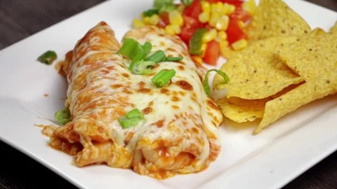 Adding Sour Cream To Chicken Enchilada Stock Footage 82983824