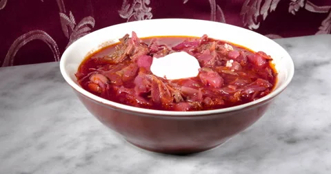 Adding sour cream to red borscht 스톡 동영상 141076852