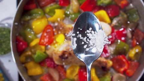 Adding spices to the chicken closeup in super slow motion 1000fps Stock Footage 257063237