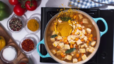 Adding spices to the curry closeup in super slow motion 1000fps Stock Footage 257062662