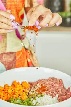Adding Spices to Fresh Ground Meat Mixture Stock Photos