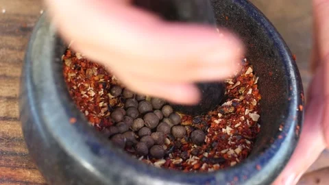 Adding spices to a grinder Stock Footage 130916766