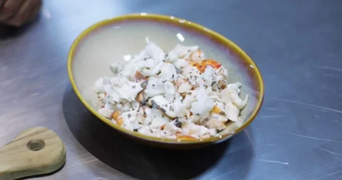 Adding spices to Lobster Seafood Dish Video stock 287968145