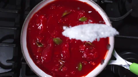 Adding spices to the tomato sauce closeup in super slow motion 1000fps Stock Footage 257061544