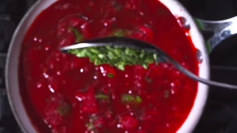Adding spices to the tomato sauce closeup in super slow motion 1000fps Stock Footage 257061991