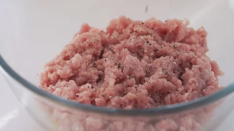  adding spices on top of forcemeat, slow motion. Stock Footage 126836186