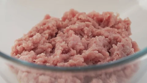 Adding spices on top of forcemeat, slow motion. Stock Footage 126836328