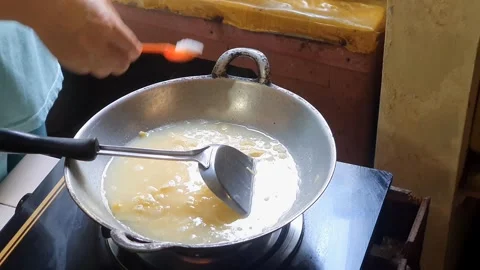 Adding a spoonful of salt and a spoonful of MSG into mixed egg or beaten eg.. Stock Footage 279294544