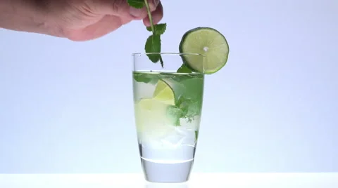 Adding a sprig of mint in a mojito Stock Footage 55183708