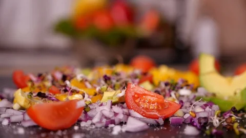 Adding sprouts to vegetables mix - closeup, slow motion Video stock 102265529