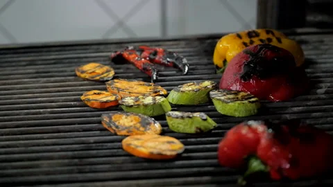 Adding Steak to Grilled Vegetables Stock Footage 132165865