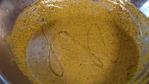 Adding steak to marinade and mixing it Stock Footage 234099374