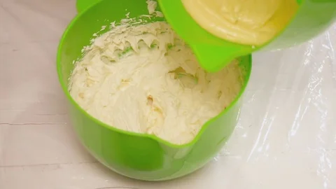 Adding stirred eggs to the mixture for tarts Stock Footage 74472060