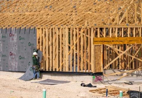 Adding structural sheathing on the dimensional lumber framing for single family Stock Photos