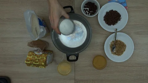 Adding Sugar And Coconut Oil In A Bowl Stock Footage 87504383