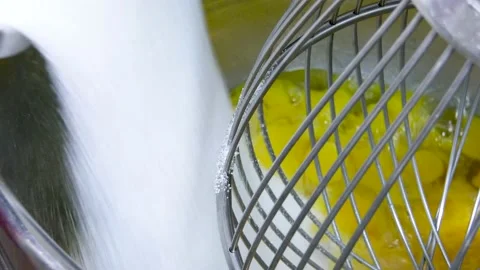 Adding sugar into a big planetary mixer UHD Stock Footage 151925884