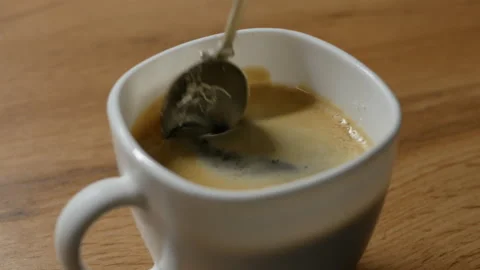 Adding sugar in a coffe Stock Footage 146363905