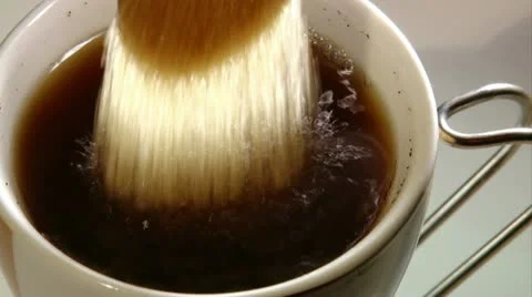 Adding sugar to coffee Stock Footage 20508840