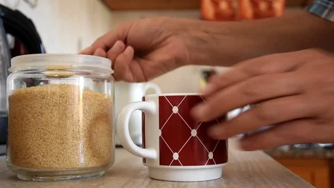 Adding sugar in the coffee Video stock 112859770