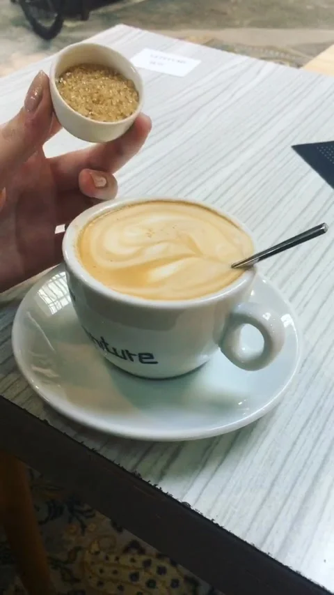 Adding sugar to coffee Stock Footage 161784913