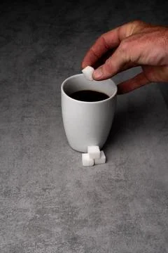 Adding Sugar to Coffee on Gray Surface Stock Photos