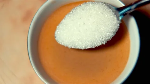 Adding sugar to coffee, stirring coffee, morning drink, coffee with foam Stock Footage 165053621