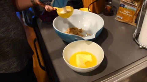 Adding Sugar to Cookie Dough Stock Footage