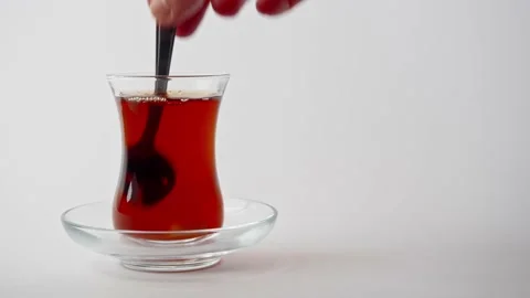Adding Sugar Cube Into Turkish Black Tea And Stirring With Tea Spoon Stock Footage 160737476