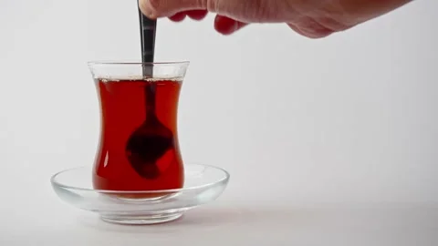 Adding Sugar Cube Into Turkish Black Tea And Stirring Stock Footage 160741220