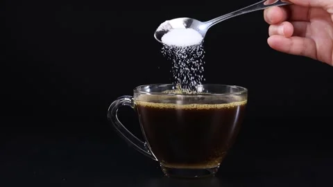 Adding Sugar to a Cup of Tea Video stock 312249663