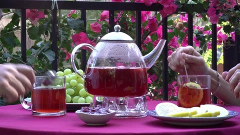 Adding Sugar To Cups of Fruit Tea at Table 動画素材 78477299