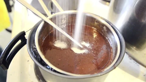 Adding Sugar to Hot Melted Chocolate Stock Footage 61945070